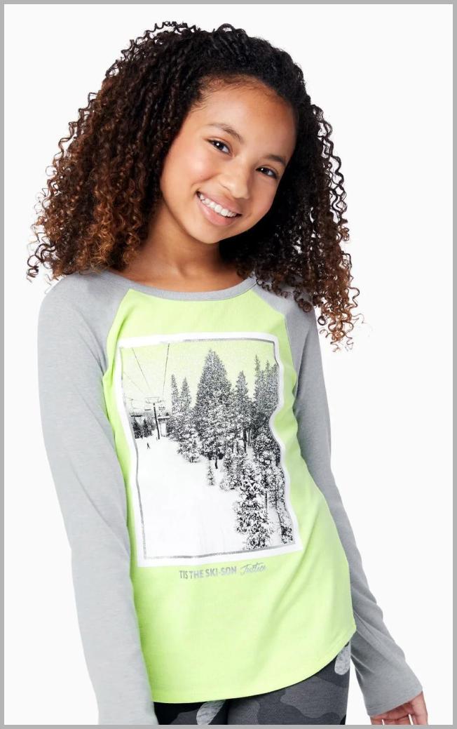 The EDF Long Sleeve Baseball Tee from Justice is a stylish and comfortable addition to any wardrobe. Crafted with quality and trendy design in mind, this tee features a captivating ski photo graphic on the front, adding a touch of adventure to your casual look. The Cloudy Heather color adds a subtle and versatile tone to the piece. Made with a long-sleeve silhouette, this baseball tee is perfect for cooler days and effortlessly combines fashion with comfort. Whether hitting the slopes or enjoying a casual day out, this tee from Justice is sure to make a statement in your wardrobe. (cgpt)